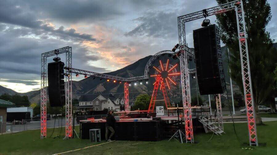 Festival stage with line arrays at sunset