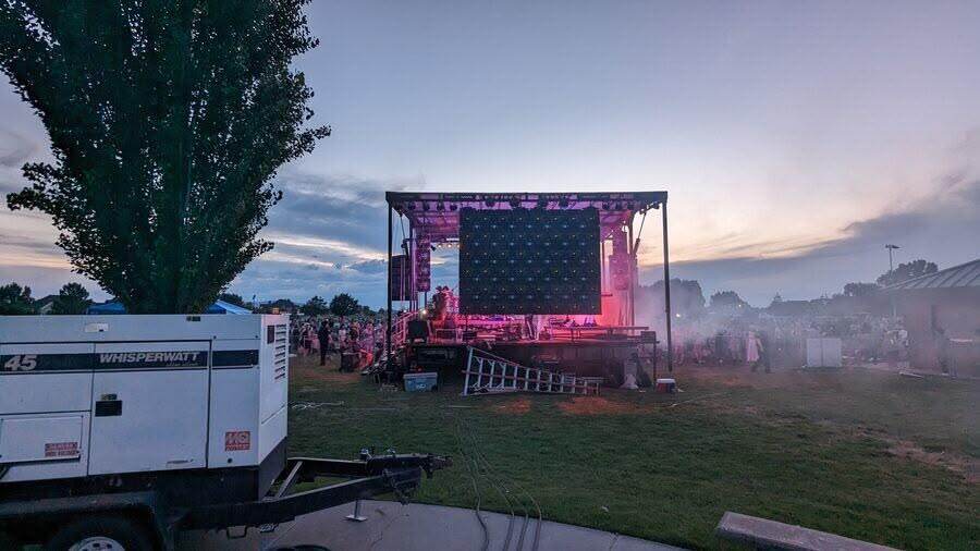 Evening mobile LED stage with a crowd