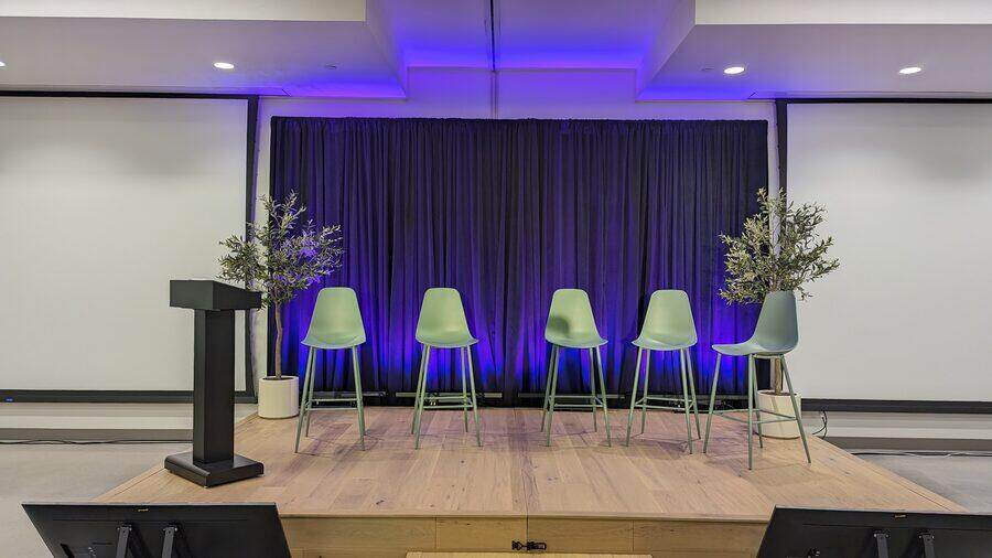 Panel stage with lounge seating and uplighting